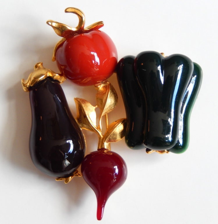A large, scarce brooch of a vegetable quartet by Karl Lagerfeld from the 1980s.  This whimsical pin includes a radish, green pepper, tomato and an eggplant.  An extraordinary example of Lagerfeld's innovative jewelry designs from this early period.