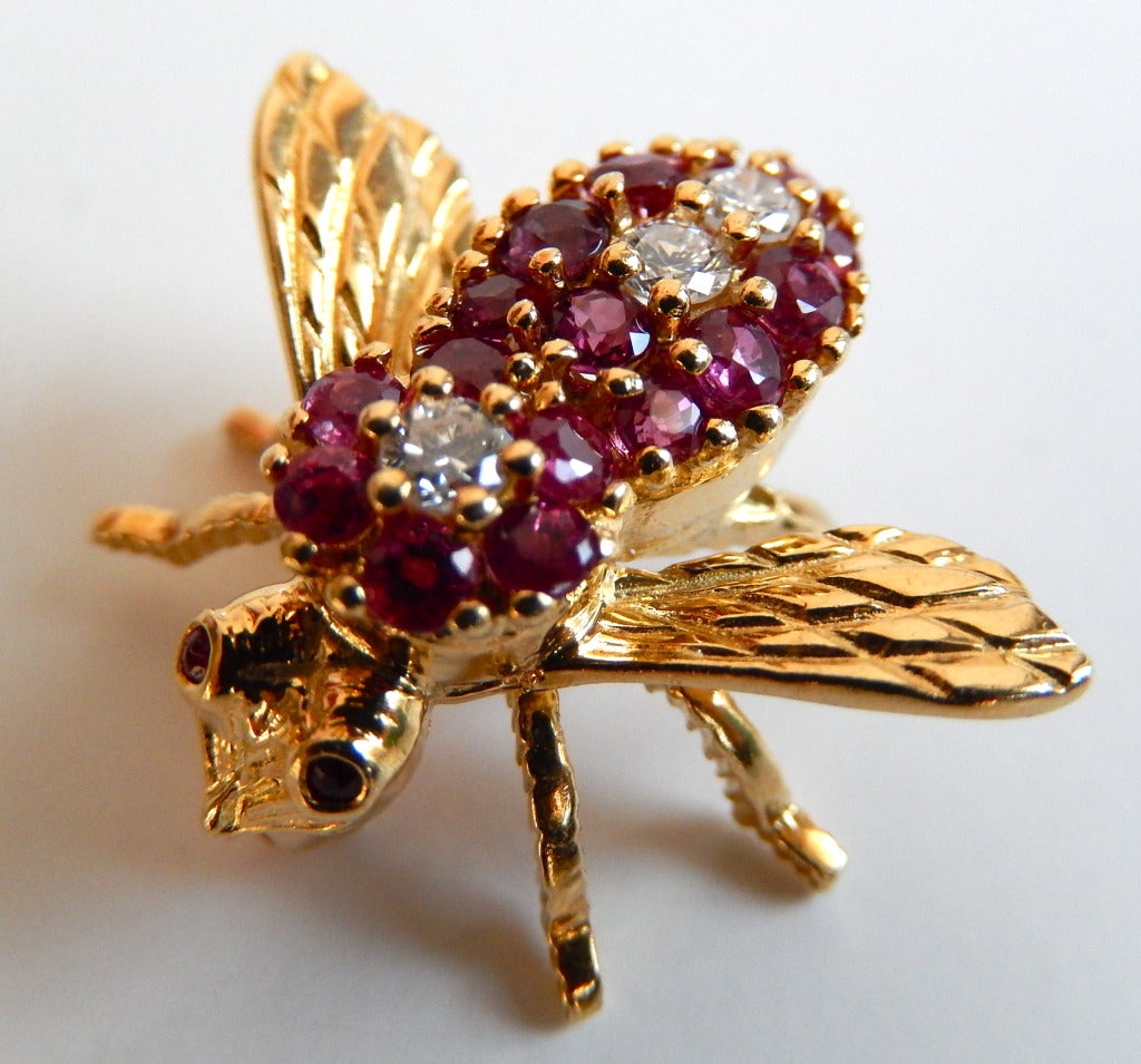 A small vintage bee pin by New York jewelry designer Herbert Rosenthal.  Using high quality stones and 18K gold, his jewelry set the standard for pins with this motif in the seventies. It is often cited that at one point Tiffany bee pins were