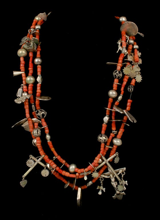 Exceptional authentic Guatemalan ceremonial necklace with 16th,  17th and 18th centuries silver coins.  Many of the coins have been shaped into birds or other symbolic Mayan fetiches. all coral no glass beads. Incredible find. A huge 76 inches in