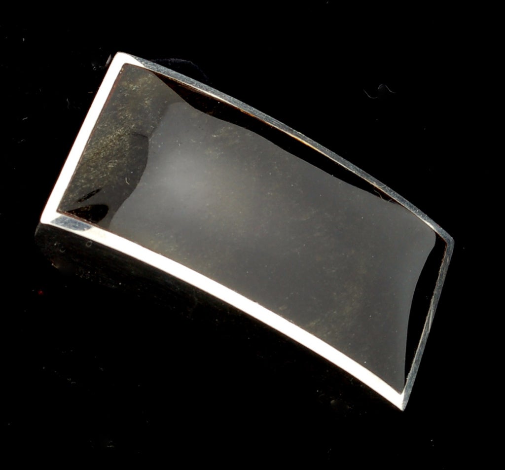 Fabulous Enrique Ledesma obsidian belt buckle. This is a sharp, clean, elegant piece of refined modernist design. This buckle can be worn by men and women. Measures 2 