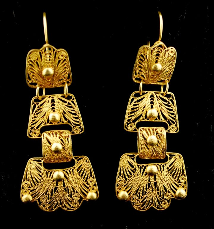 Fabulous tiered Oaxacan earrings from the Tehuantepec region. These earrings were made probably in the early 20th C and are made in 12k gold. They are 2