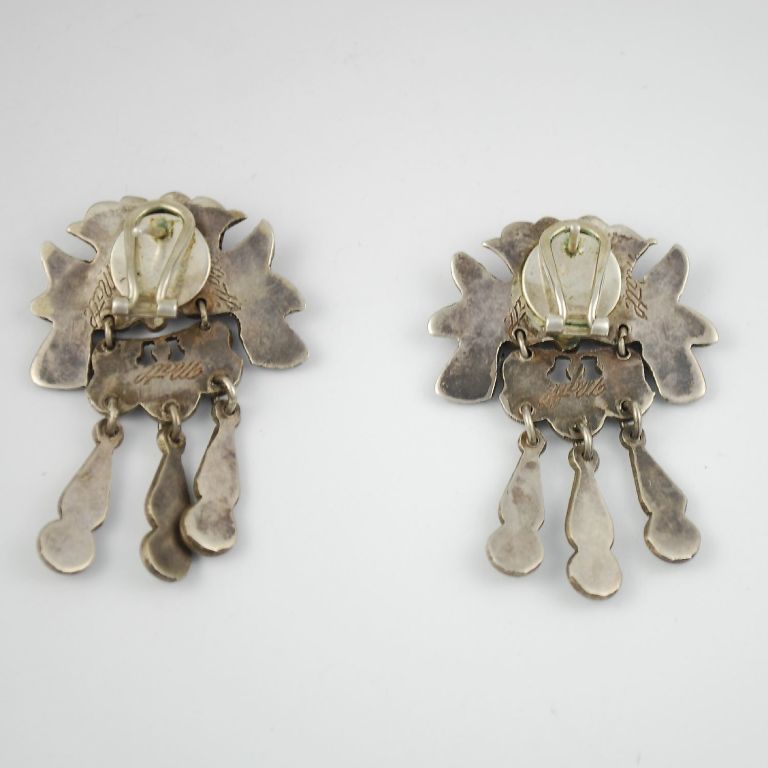 These earrings are a superb find. Made by Matilde Eugenia Poulat  (aka MATL) probably in the 1930s, the earrings were professionally converted into post with clips. These fine repousse pieces are iconic MATL pieces and very, very difficult to find.