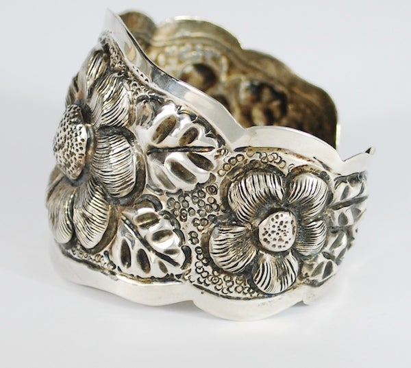 Vigueras was one of the most prominent Mexican silversmiths at the turn of the 20th C.  This is a rare find made in the Vigueras taller.  The piece is made in heavy silver and has rich detailing. Many of these cuffs were made with floral motifs