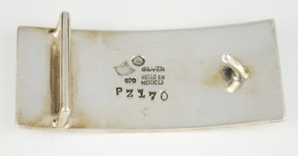 Luscious moderne belt buckle by the great Mexican modernist Antonio Pineda.  Antonio's pieces are highly desirable and collectible.  This is a rare buckle design. The buckle is made in silver 970 (higher than sterling) and inlay stone.  The stone