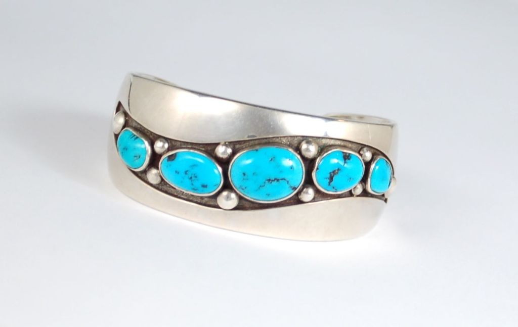 Frank Patania Senior was an Italian immigrant that who was able to merge European esthetic with Hopi and Navajo jewelry styles.  This cuff is a unique and gorgeous example of his best designs. Marked as shown with the Patania hallmark and the