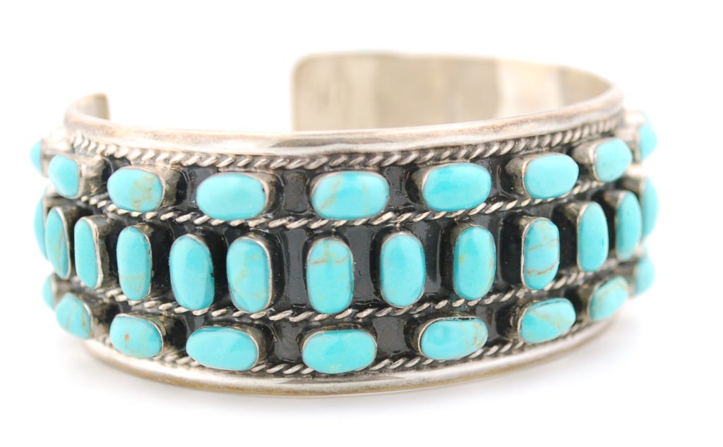 Phenomenal cuff bracelet made in sterling and turquoise.  The base of the bracelet is enameled in black to make the color homogeneous allowing the turquoise color to stand out in an impressive way.6