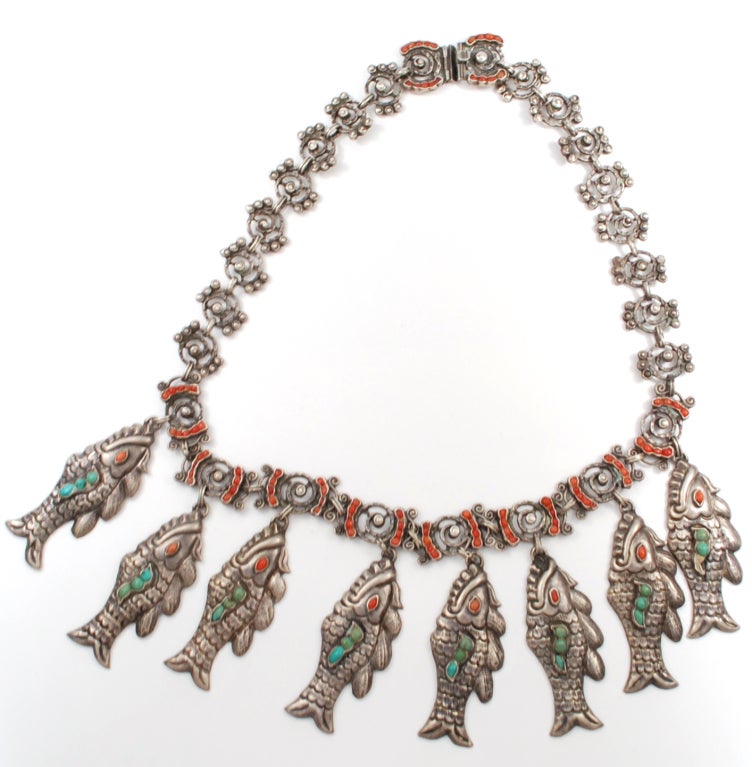Fabulous necklace is the design of Matiled Poulat but executed by the Barreto Taller in Mexico City.  This old piece dates from the 1930's an d it is a fabulous necklace in the style worn by Frida Kahlo. The original fish necklaces originate from