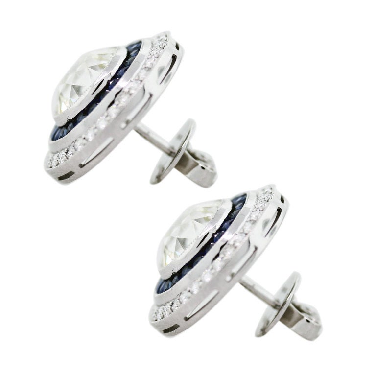 Buy these Platinum 5.90ctw Diamond and 1.40ctw Sapphire Earrings in store or online.

Style: Platinum 5.90ctw Diamond and 1.40ctw Sapphire Earrings
Material: Platinum
Gemstone Details: Approximately 1.40ctw of Princess cut Sapphires
Diamond Details: