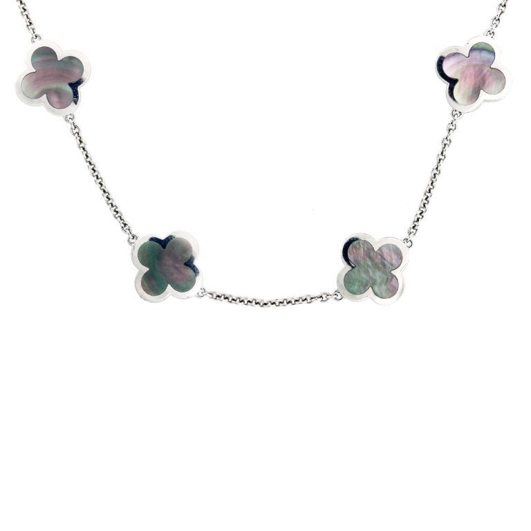 Van Cleef & Arpels Necklacenecklace from the Alhambra collection. There are 9 Tahitian Mother of Pearl Clover Motifs set in 18K White Gold. 16.25