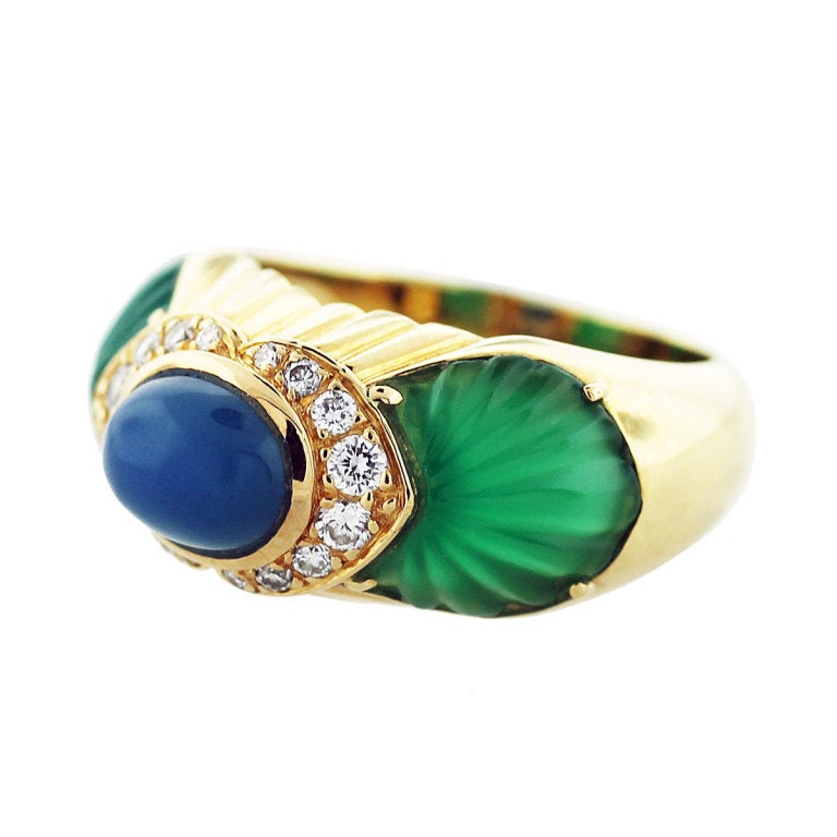 Cartier Ring. Material- 18K Yellow Gold. There are Approximately 0.40ctws of Diamonds, G/H in Color and VS in Clarity. The center stone is Chalcedony and the two side stones are Chrysoprase. Size 5.75.