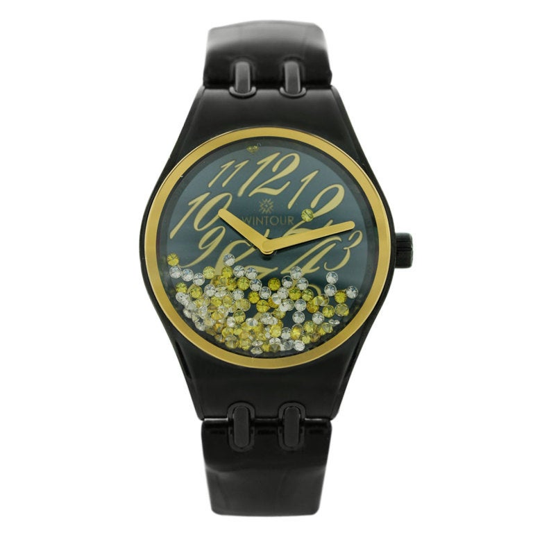 The Wintour watch has a case diameter of 36mm. It is stainless steel with an 18k Yellow Gold Bezel. Within the dial there are floating conflict-free white and yellow diamonds. 

The original retail price for this watch is $18,000. It comes with the