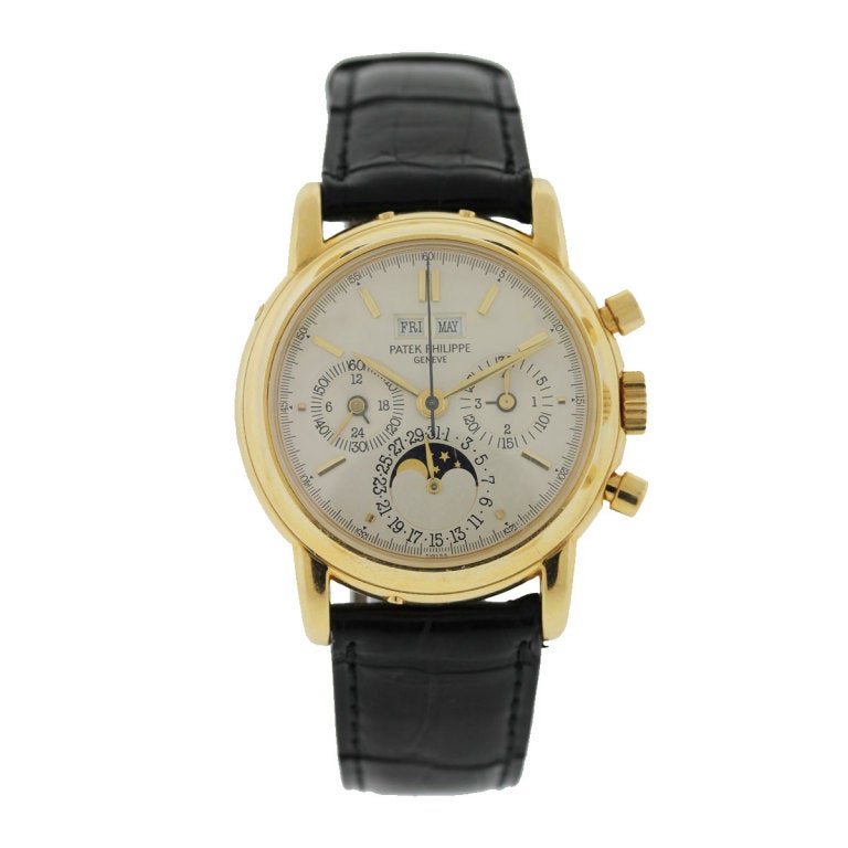 Patek Philippe Perpetual Calendar Wristwatch, Ref. 3970, in 18k Yellow Gold
36mm Case Diameter, Leather Strap, Smooth 18k Yellow Gold Bezel
Silvered Chronograph Dial with Date, Month, and Day Indication
Scratch Resistant Sapphire Crystal,