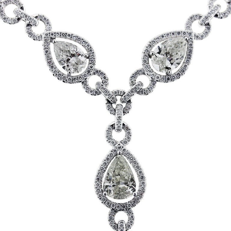 Description: 21 Carat Pear and Marquise Shape Diamond Y Necklace. Metal: Platinum. Main Diamond: 2.19ct Pear Shape Diamond, F/G in Color and SI2 in Clarity. Measurements: Main Diamond is 12.20 x 7.30 x 4.12 mm. Diamond Details: 19.04ctw of Pear