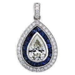 1 Carat Pear Shape Diamond and Sapphire Pendant in Platinum