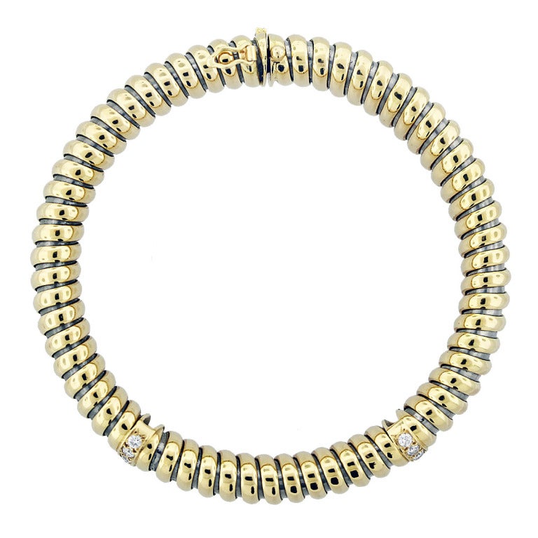 Style 	Cartier Ribbed Diamond Bracelet
Material 	18K Two Tone Gold
Diamond Weight Approx 0.42ctw
Diamond Color G/H
Diamond Clarity VS/SI
Total Weight 	15.3 dwt (23.8 g)
Measurements 	7.25