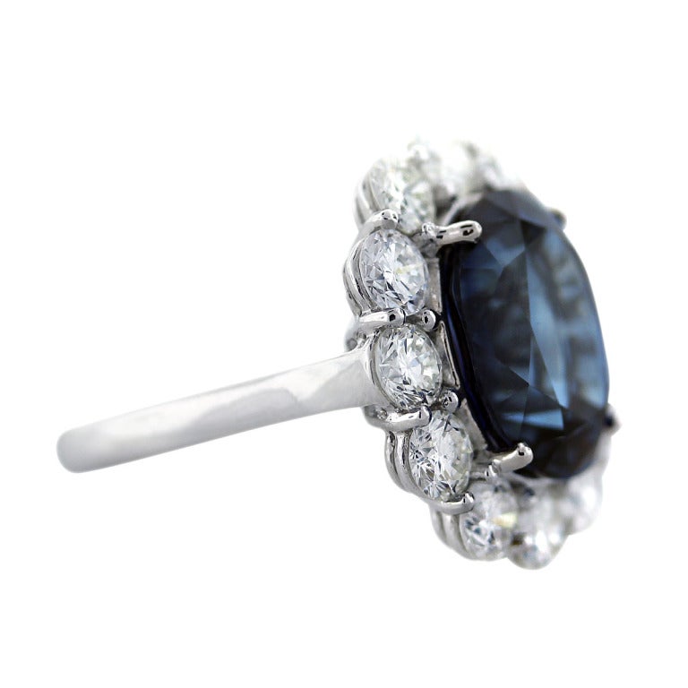 Style: 8.56ct Ceylon Sapphire and Diamond Cocktail Ring
Material: Platinum
Diamonds: 2.65ctw of Round Brilliant Cut Diamonds, F/G in color and VS in Clarity
Gemstone: 8.56ct Ceylon Sapphire (13mm x 11mm)
Ring Size	Size: 6.5
Total Weight: 6.8dwt