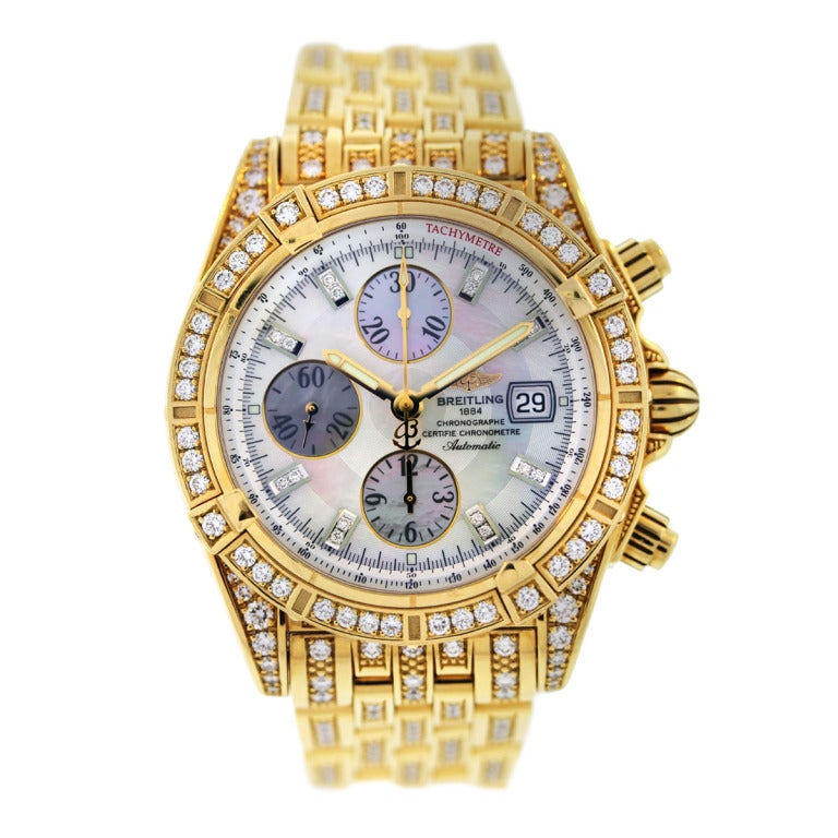 18k Yellow Gold Breitling Chronomat with Mother of Pearl Dial and Factory Original Diamonds 
Case Measurements, 44 mm Wide x 55 mm Long x 17 mm Thick; 18k Yellow Gold Uni-Directional Diamond Bezel; 18k Yellow Gold Diamond Bracelet; Automatic