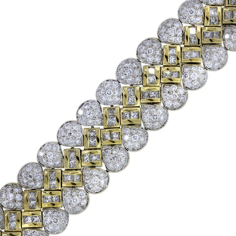 You are Viewing this 18k Yellow Gold Pave Set and Princess Cut Diamond Statement Bracelet! Diamond Carat Total Weight, 15.0; Diamond Color and Clarity, G/H, VS; Size, Will fit 6.5'' Wrist; Weight, 80.2g (51.6dwt); Clasp, Tongue and Box Clasp with