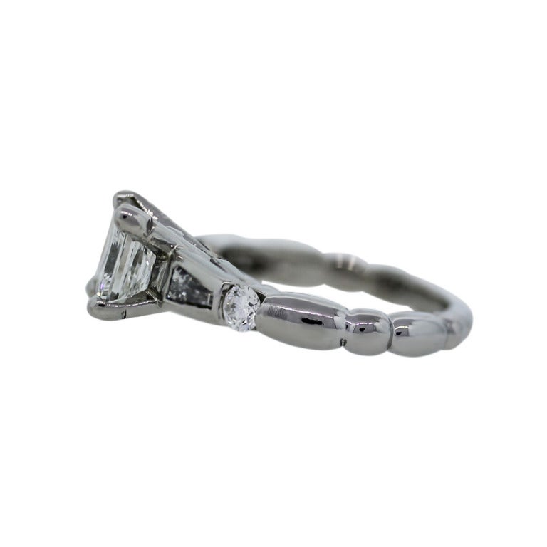 You are Viewing this GIA Certified 1.24ct Princess Cut Diamond Platinum Engagement Ring! Diamond Color, H; Diamond Clarity, VVS2; Diamond Total Carat Weight, 1.69; Main Diamond Carat Weight, 1.24ct; Material, Platinum; Additional Diamond Shapes, 2