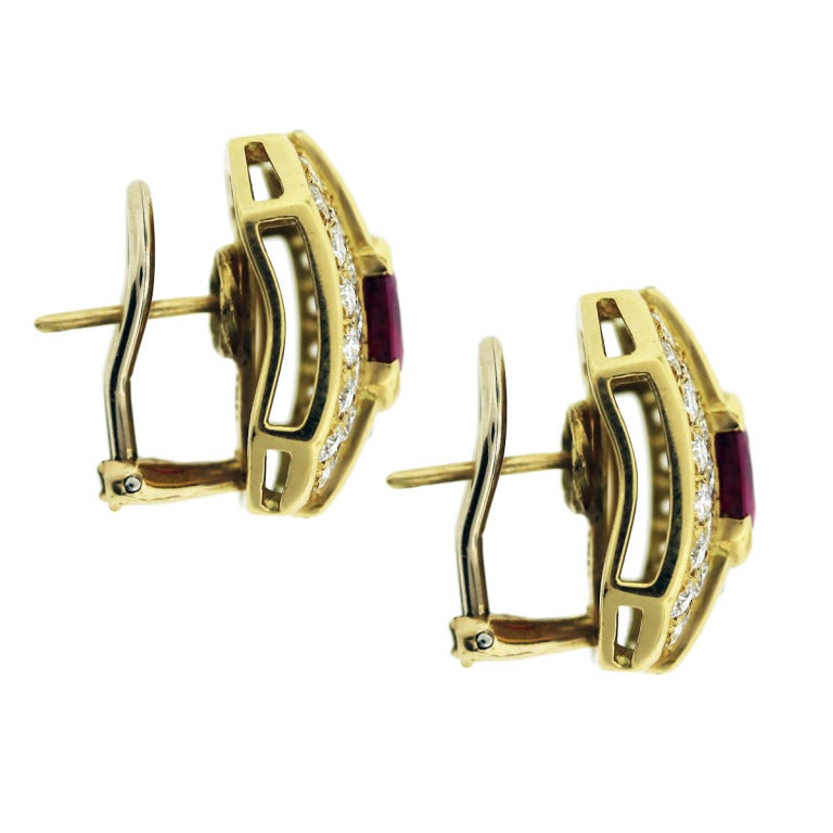 You are viewing these Ruby and Diamond Earrings. Material; 18K Yellow Gold.
Diamonds; 4.0ctw of Diamonds. Diamond color; F/G. Diamond Clarity; VS.
Gemstone; Approximately 4.3ctw of Rubies. Total Weight; 8.8dwt (13.7g). Backs; Omega Backs with