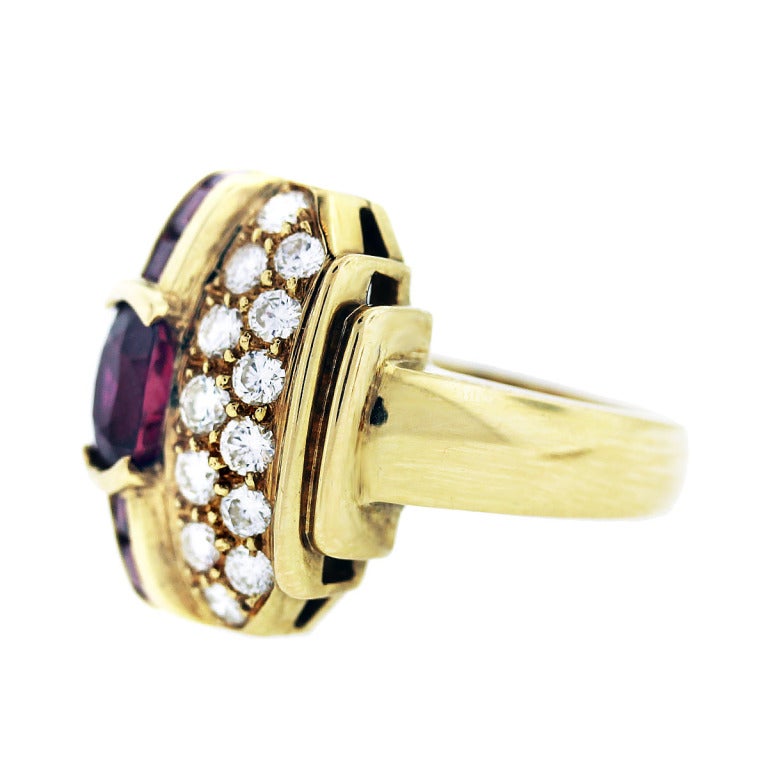 You are viewing this Yellow Gold Ruby and Diamond Ring. Diamonds; Approximately 2.0ctw of Round Diamonds. Diamond color; F/G. Diamond clarity; VS. Rubies; Approximately 2.3ctw. Mounting; 18K Yellow Gold. Size; 5.75.