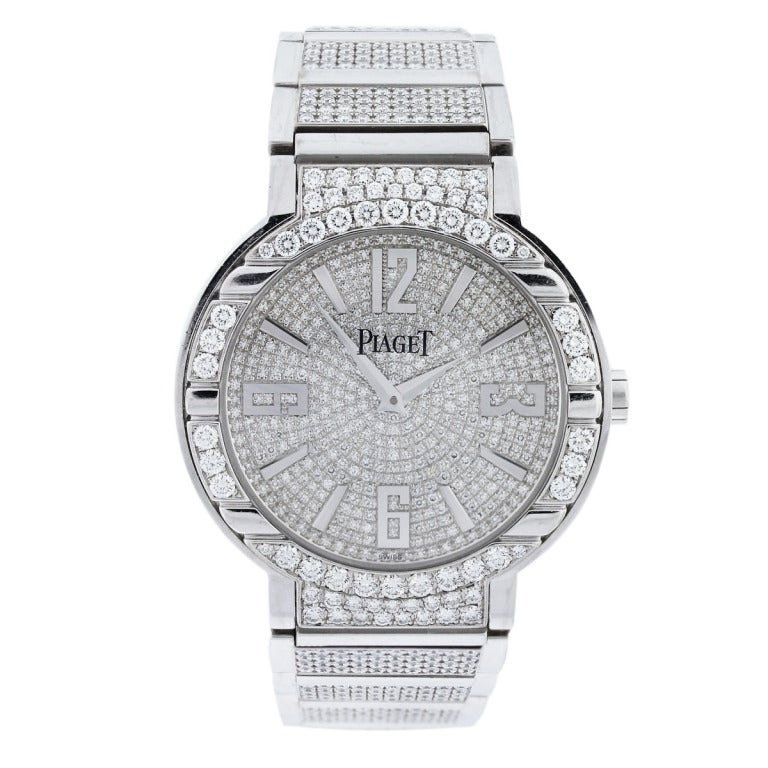 Piaget
Model: Polo
Reference: 27705
Movement: 534P Automatic
Case Measurement: 40mm
Case Material: 18k White Gold
Dial: All Pave Set Round Factory Diamond Dial with 18k White Gold Dial Markers, approx. 2ctw
Bezel: All Diamond Factory Bezel,