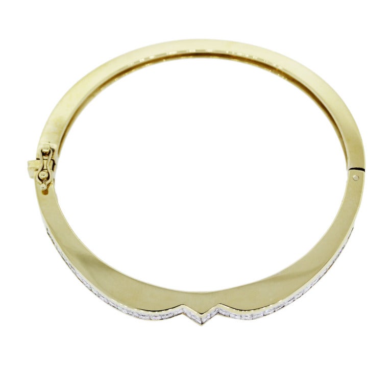 Style: 18kt Yellow Gold Princess Cut Diamond Bangle Bracelet. Material: 18K Yellow Gold. Diamond Details: Approximately 5.75ctw of Diamonds. Diamonds are H/I in Color and VS in Clarity. Total Weight: 40.6g (26.1dwt). Bracelet Details: Bracelet will