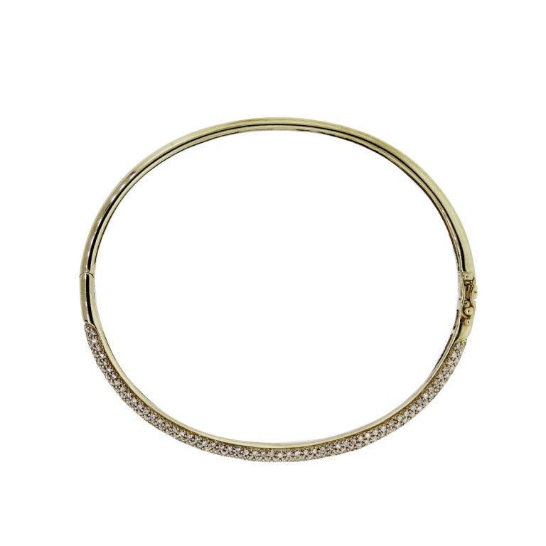 Style	:14K Yellow Gold Pave Set Diamond Bangle Bracelet
Material: 14k Yellow Gold
Diamond Details: Approx. 1.70ctw of Round Cut Diamonds
Diamond Color: G/H
Diamond Clarity: VS
Weight: 10.4g (6.7dwt)
Measurements: will fit an 7
