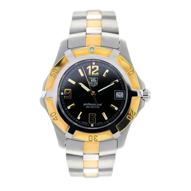 Company: Tag Heuer
Model: Professional
Case Material: Stainless Steel and 18k Yellow Gold
Reference Number: WN1154 
Case Diameter: 37 mm
Movement: Quartz
Bezel: 18k Yellow Gold Uni-Directional Bezel
Bracelet: Stainless Steel and 18k Yellow