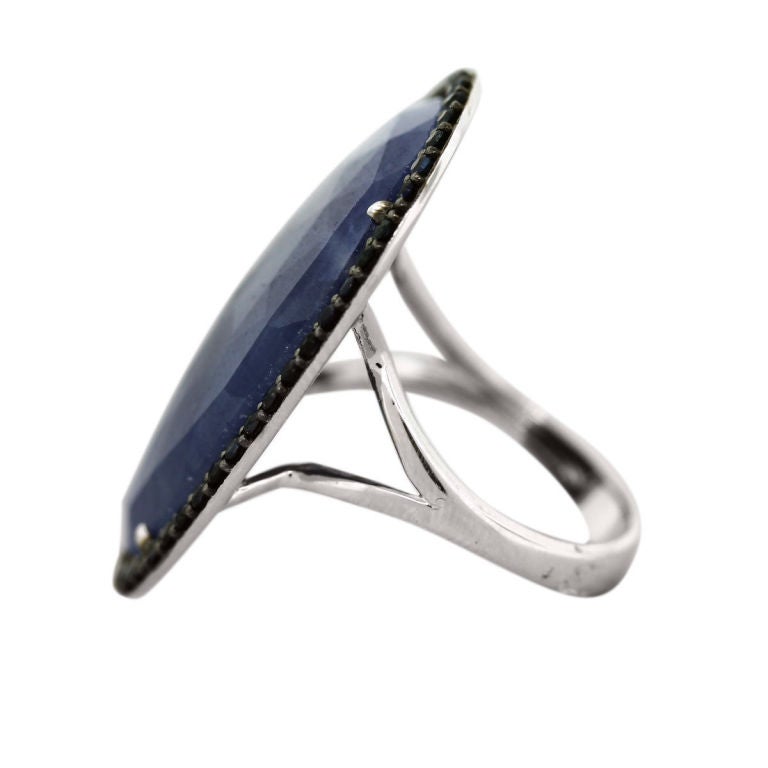 Style: 14k White Gold Oval 26.69ctw Sapphire Ring
Metal: 14k White Gold
Gemstones: Oval Sapphire 
Gemstone Measurement: 1.1'' x 0.75'' 
Accent Sapphires: Approximately 0.8 mm
Size: Will fit 7.25 (Can Be Sized)
Item Weight: 6.0 dwt (9.2g)
