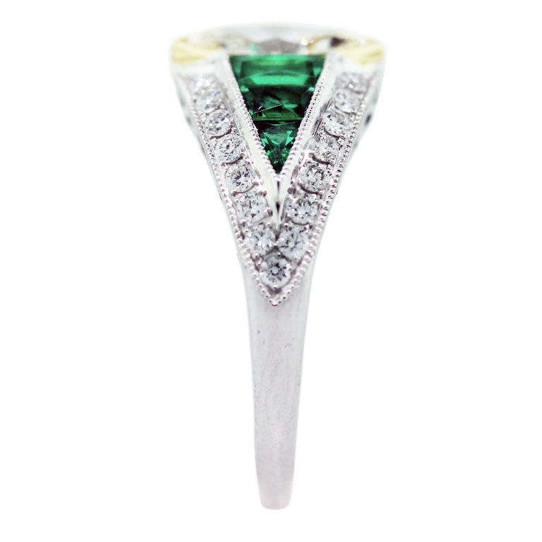 Center Stone is 0.86ct, L/M in Color and VS in Clarity. Ring has 0.51ctw of Emeralds and 0.32ctw of Accent Diamonds, G/H in Color and VS in Clarity. Size 6.5 (Can Be Sized)