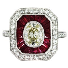 Oval Diamond, Ruby and Platinum Engagement Ring