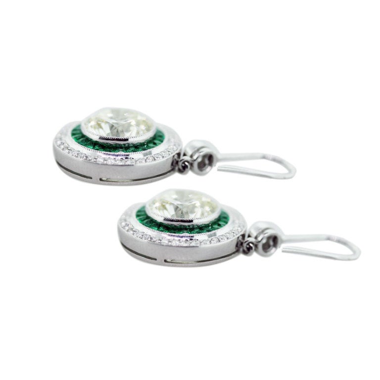 6 Carat Diamond, Platinum and Emerald Style Drop Earrings, Main Diamond Measures 9.9mm. Main Diamonds are 6.01ctw K/L in Color and VS in Clarity. Accent Diamonds are 0.84ctw H/I in Color and VS in Clarity. The Diamonds are Graded Conservatively and