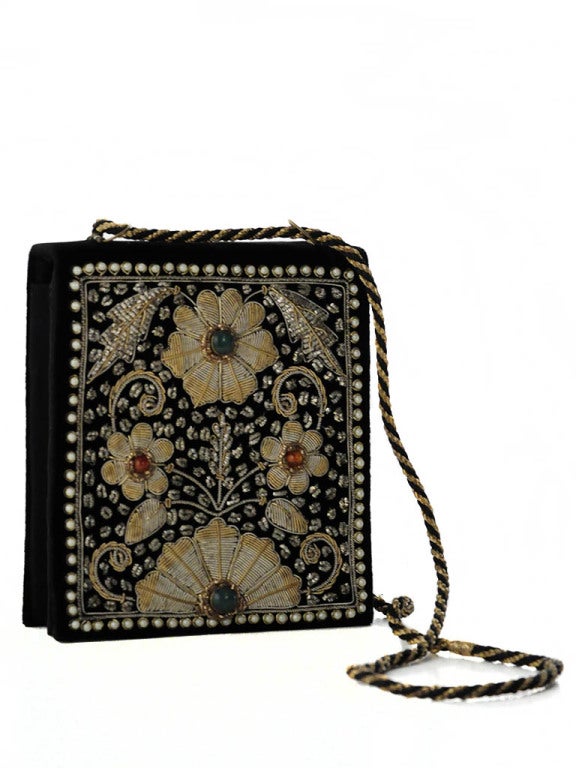 Unique Huguette Creations handbag with real gold embroidery, pearl trim and jade and coral colored stone embellishments. Handbag has a gold and black cord-like strap, single snap closure and three interior pockets. Measurements- Height: 6.75