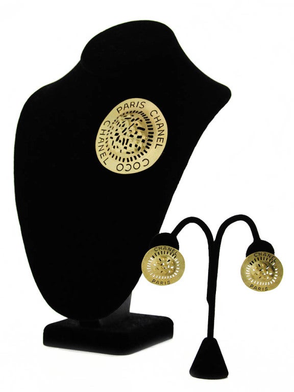 Matte gold Chanel tribal inspired brooch and clip-on earring set. Brooch is stamped; 