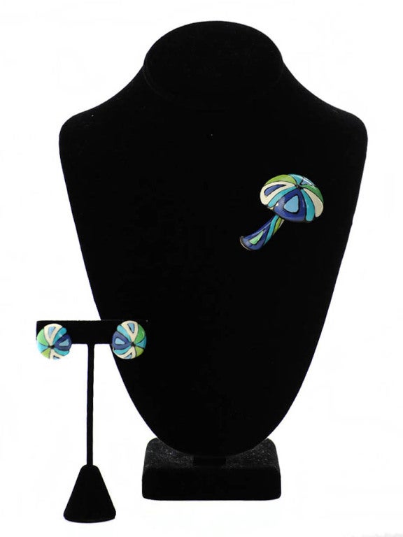 Hand painted Eisenberg Enamels mushroom brooch and clip-on earring set. Brooch and earrings are made of 18k gold and are painted in vibrant hues of blues and greens. Measurements: Brooch- Height: 2.5