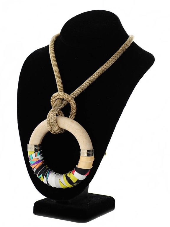Thick gold rope-like chain necklace knotted around a raw colored wooden bangle that is wrapped in iconic Pucci print fabric. The two silver stoppers on each end of the fabric are stamped; 