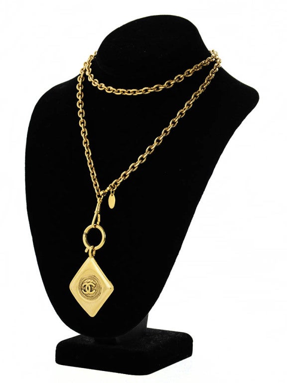 1980's Chanel pendant necklace. Diamond shaped pendant with Chanel logo in center.