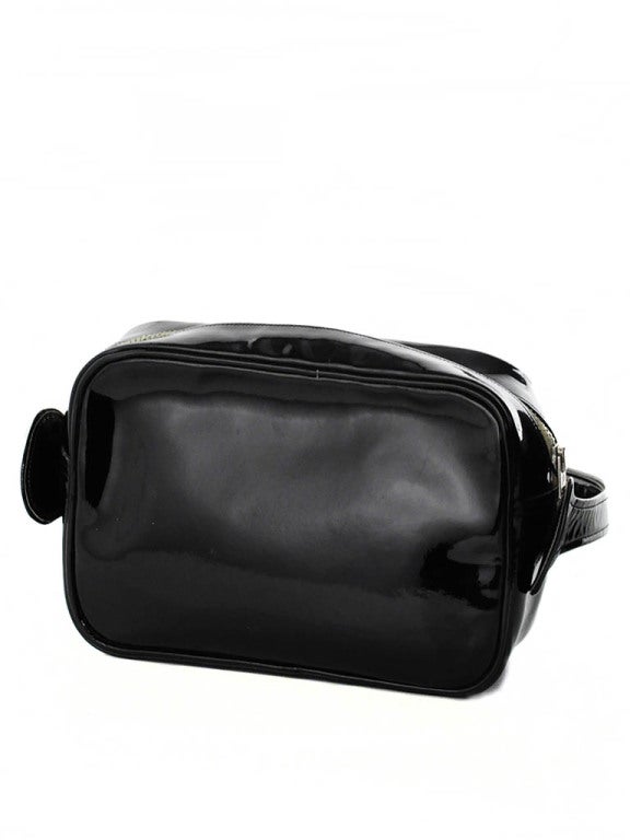 Vintage Courreges black patent leather mod inspired handbag with metal zipper closure. One interior pocket. Measurements- Strap: 41