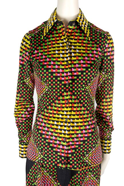  Fab 2p. Top and maxi skirt set ensemble in black, red, yellow, pink and green kaleidoscope prism print motif presented by Mr. Dino features traditional collar, long sleeves with one button cuffs, and button down front placket closure. Maxi skirt