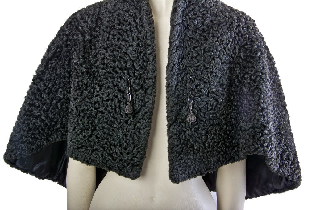 Vintage Black Russian Lamb Cape
Lined
Features two tassels on front
Soft Russian Lamb