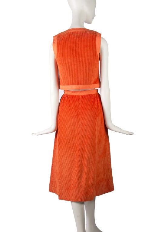 Courreges Paris
Couture Future
Made in France
Bright Orange Corduroy
Sleeveless Vest Top with Button Closure
Matching Skirt with Button Closure & Two Front Pockets
No size marked, please see measurements
Vest Measurements
Shoulders 14