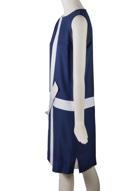 Courreges
Navy with White Trim and Bow
Rayon & Acetate Dress
Zip up the back closure
Lined
Made in France. 

Measurements:

Total length - 39 inches
Waist - 36
Hips - 38
Shoulder to shoulder - 14 inches
Bust - 36 inches 
