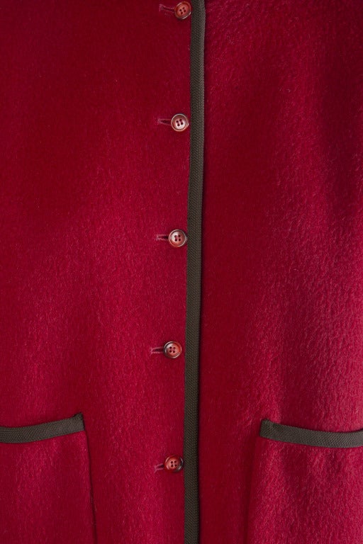 Pierre Cardin Coat
Red Wool
Lined
Black Edging & Detail
Button up the front closure
Size 6
No collar
Two front Pockets