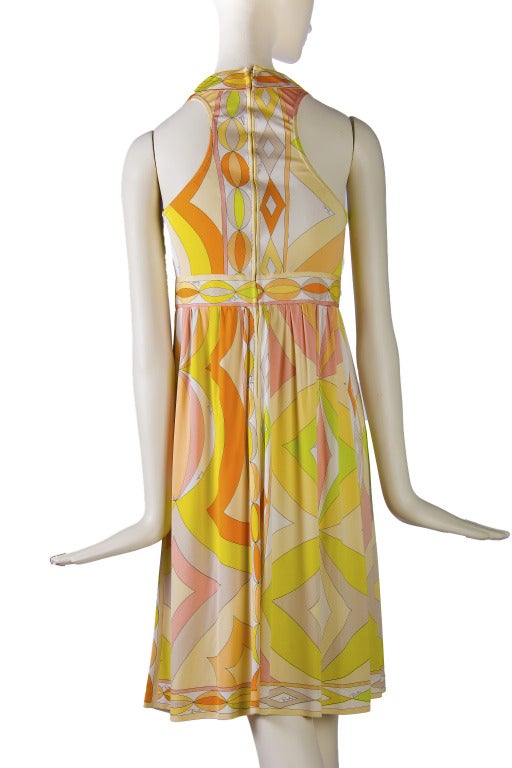 Emilio Pucci Dress
Halter Racer Back
Hidden Zip up the back with eye & hook
Banded waist & neckline
Sleeveless
Pleat in front
100% Silk
Made in Italy
Size not marked, please see measurements
This is an extremely rare style from the 1960's. I have