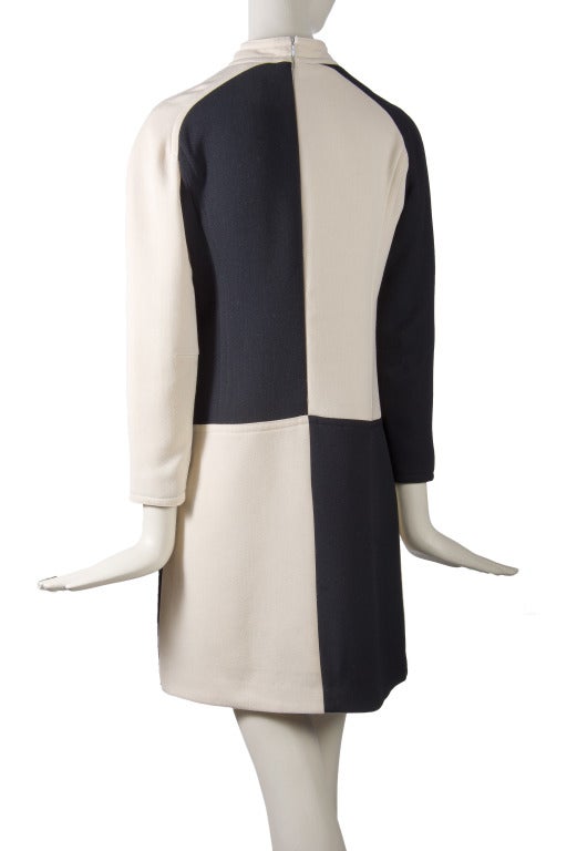 Courreges Dress
Black & Creme Color Block
Hidden Zip up the Back
Stand up Collar
Long sleeve
Lined
Wool
Made in France