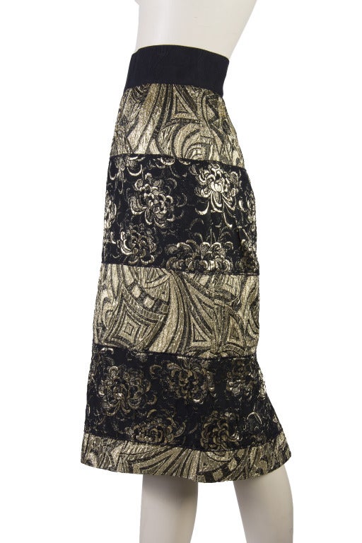 Big sale price on these fantastic skirts
Dolce & Gabbana Skirt - New with Tags
Elastic Waist 
Hidden Zip and Two Snap Closure up the back
Black & Gold Lame 
Lined
Slit in Back
Sizes 40, 42, & 46 available
Size 40 Measurements:
Waist