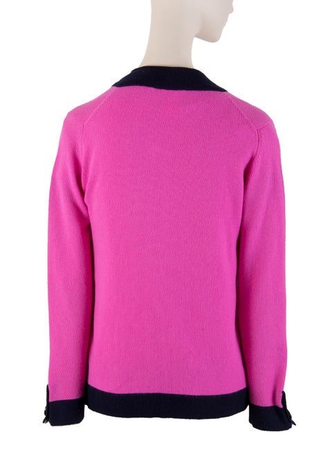 Drop Dead Chanel Sweater Set
Buttons are absolutely beautiful. 
Fabulous colors: Fuchsia & Navy
100% Cashmere
2 Piece
Scoop Neck
Short Sleeve
Cardigan sweater has one CC logo button closure 
Logo button at each wrist
Made in United