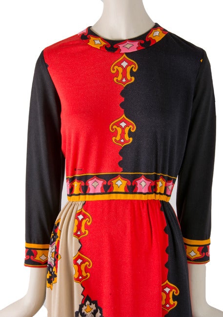 Presented here is a fabulous vintage dress from Paganne. This 1960's mandala print dress has an elastic waist and is in colors of red, black, orange, white and pink. There is a bit of stretch throughout this fabulous dress. The dress has 3/4 long