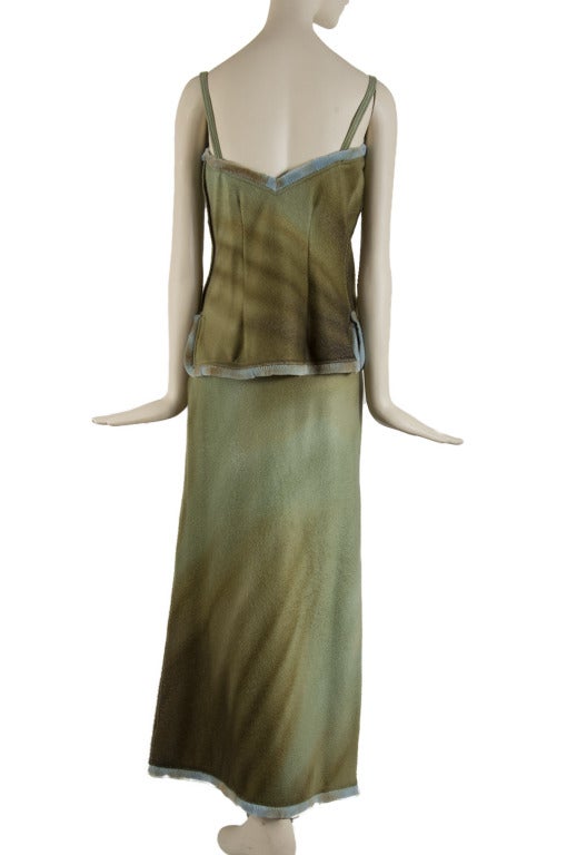  Presented here is a magnificent Fendi runway cashmere 2-piece set. The spaghetti strap  top has silver tone buckle hardware with blue fur trim.  It also has a side zip closure.  The maxi skirt has a banded blue mink trim waist and hemline.  Both